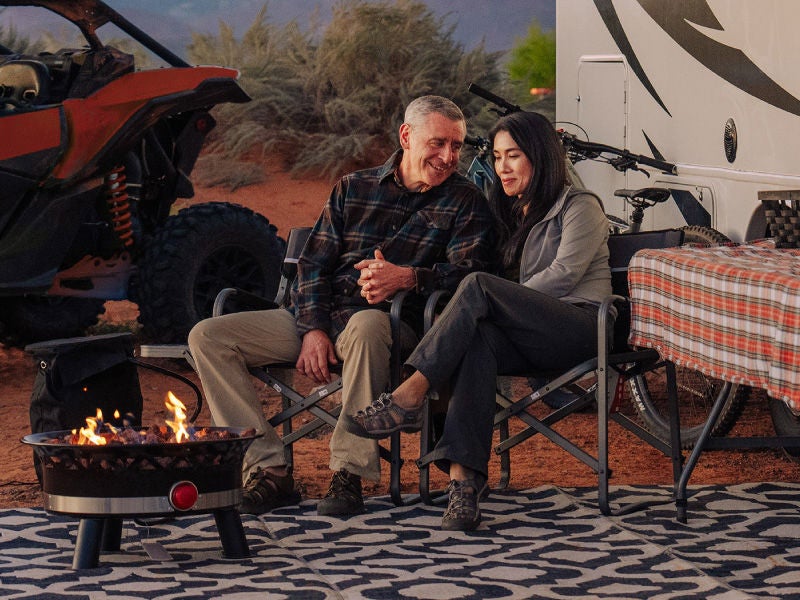 Family motorhome parked at a national-park campsite — AFCU auto loan