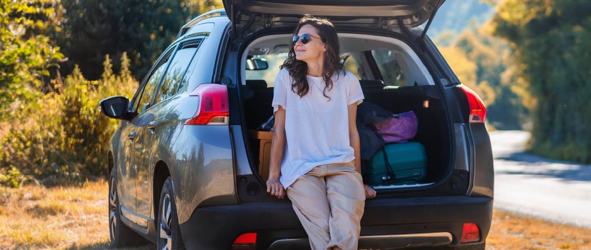 Family loading luggage into a vehicle financed through AFCU