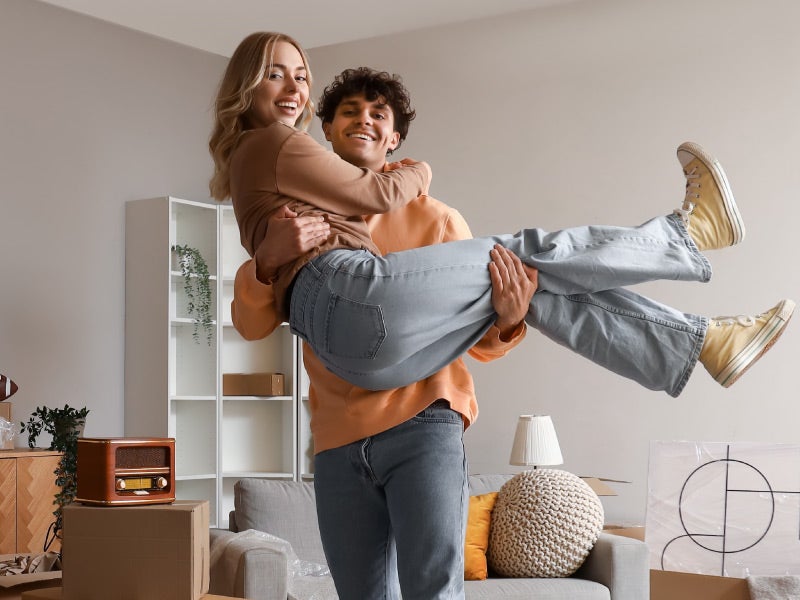 First-time homebuyers holding new keys