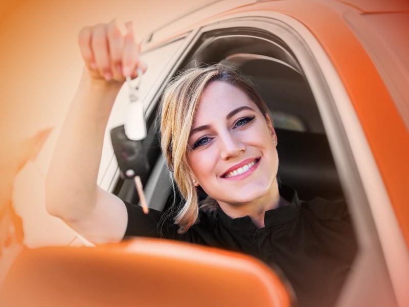 New car keys handed to an AFCU member after auto loan funding