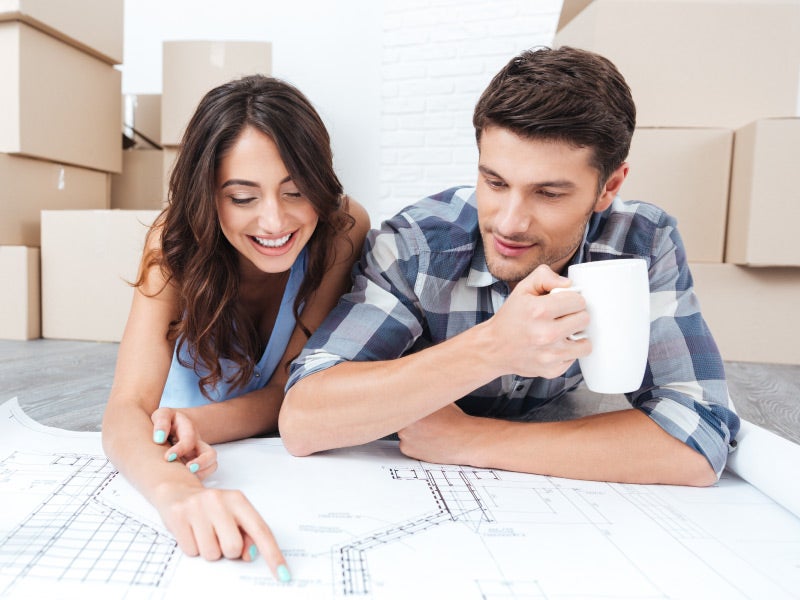 House under construction with framing in progress — America First mortgage